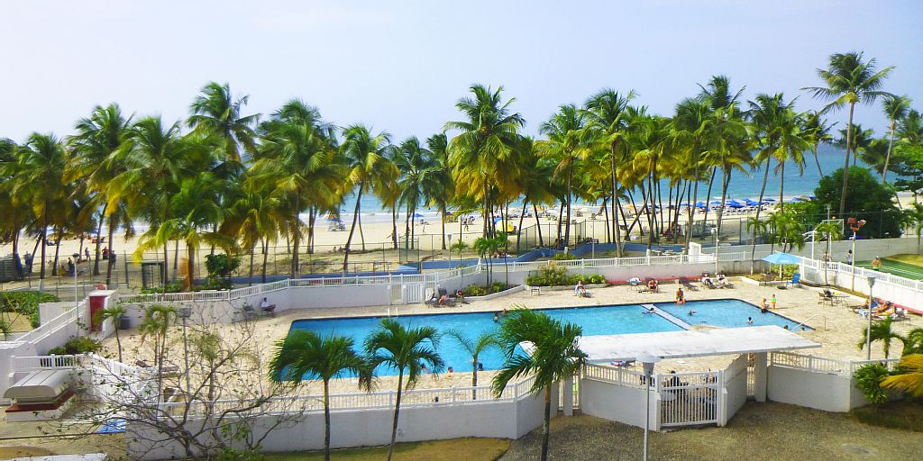 Direct view to the pool area and Isla Verde beach.