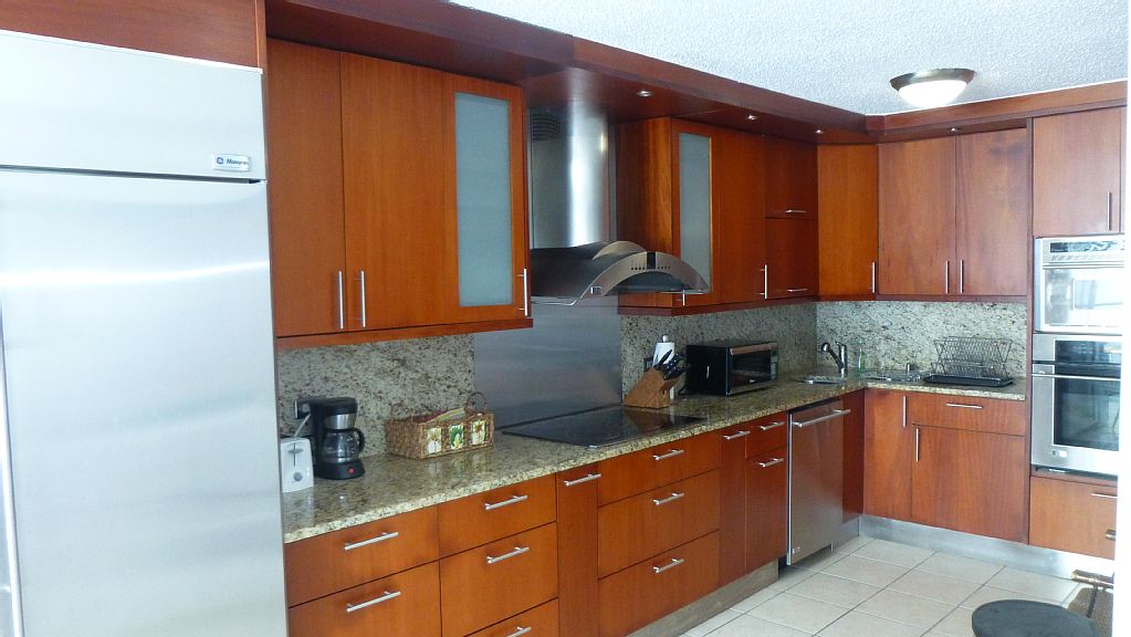 Fully equipped kitchen with stainless steel appliances.