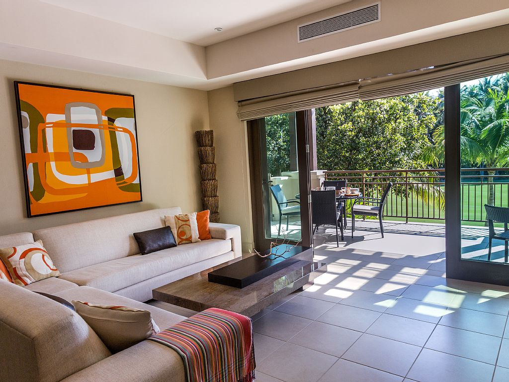 Spacious living room opens up to terrace and great views.