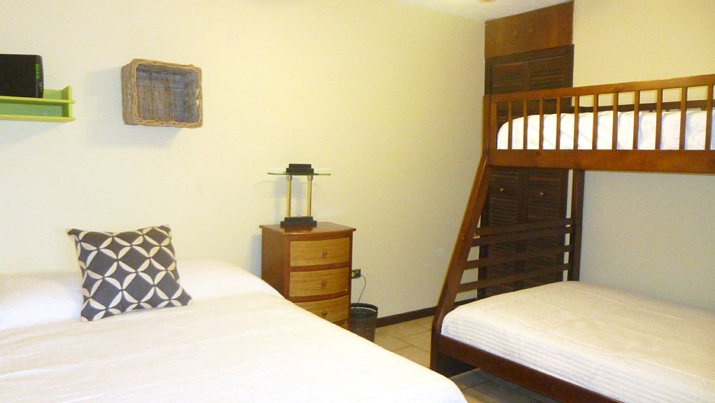 Third bedroom accommodates up to 4 guests comfortably.