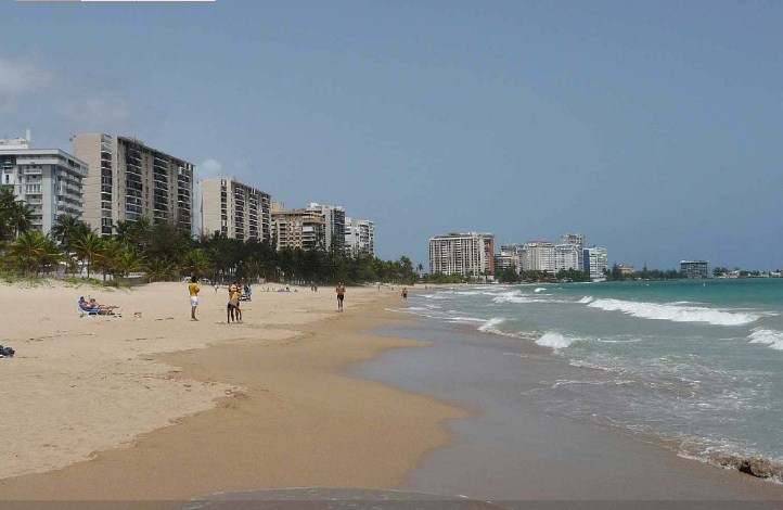 The beach, facing West. Kite surfing lessons down the beach.