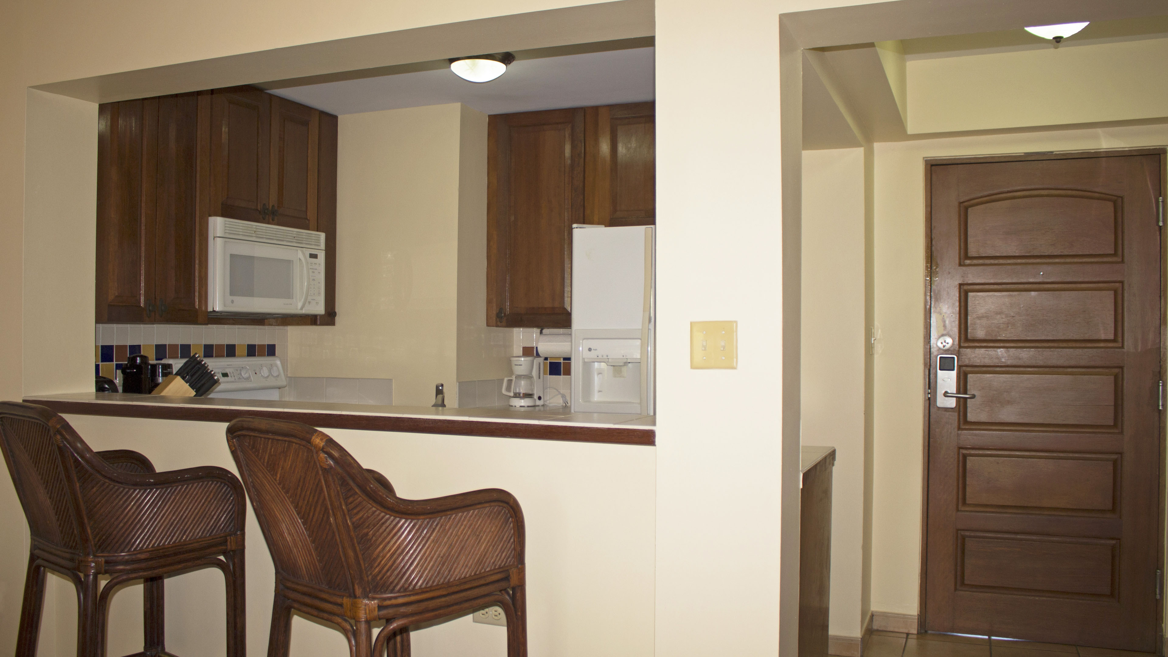 Kitchen has bar area that opens to the dining room.