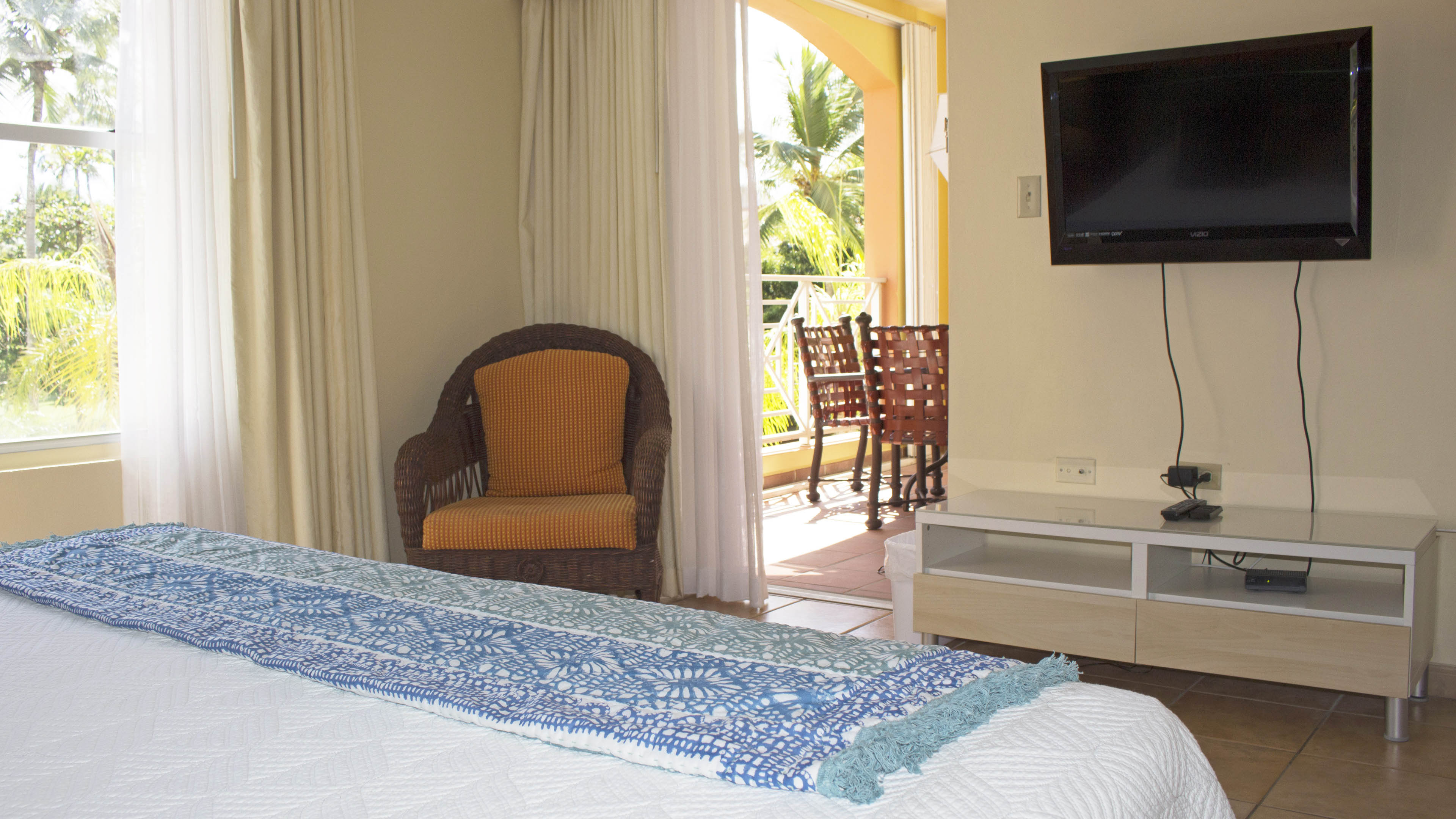 Master bedroom has TV and direct access to the balcony.