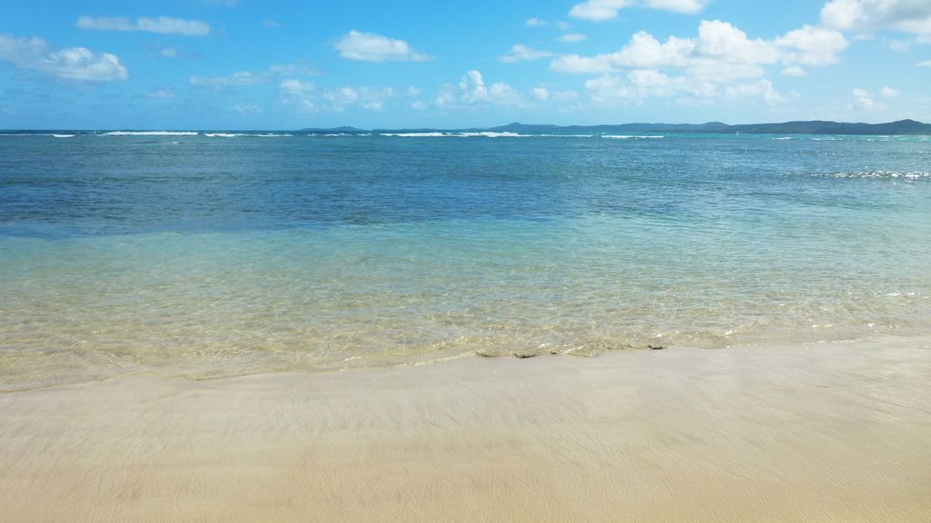 Clear blue waters from Luquillo Beach at your feet